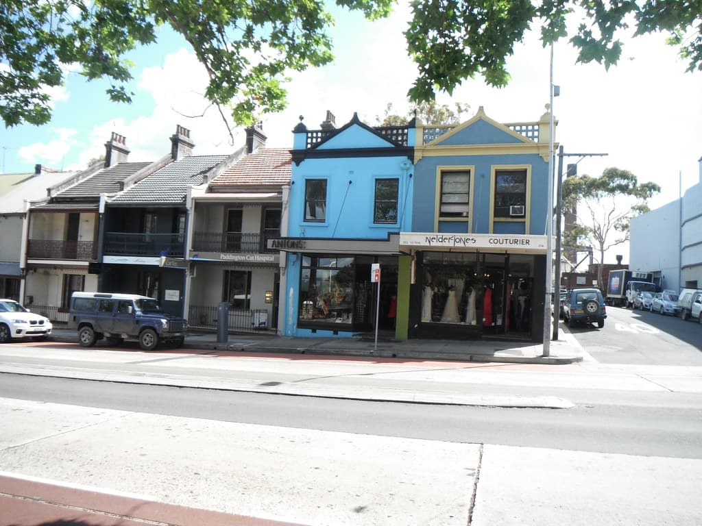 A row of Victorian terrace houses and shopfronts in Paddington, Sydney